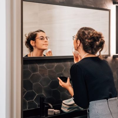 Woman putting on makeup