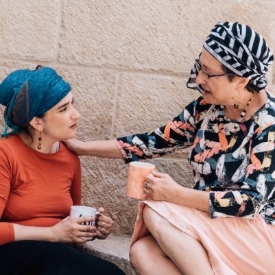 Woman comforting friend