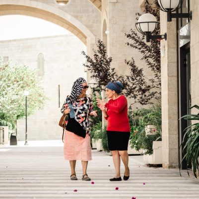 2 women walking outside