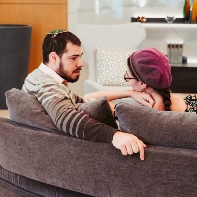 Couple discussing on couch 2