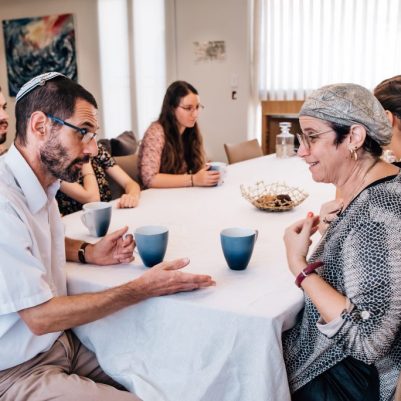 Couple in discussion at table