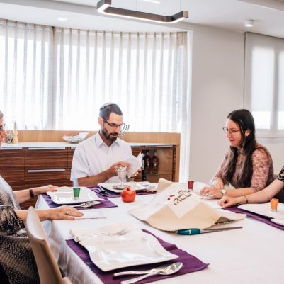 Family sitting for kiddush on Rosh Hashana