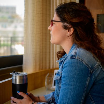 Woman looking out window