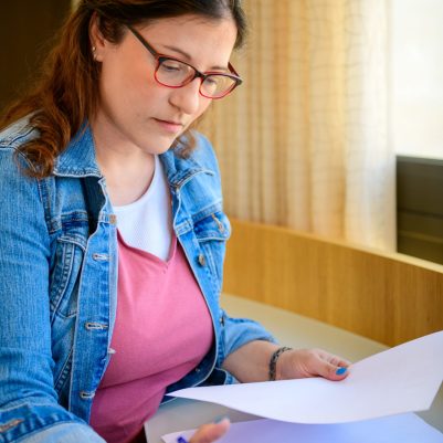 Woman working looking at papers 2