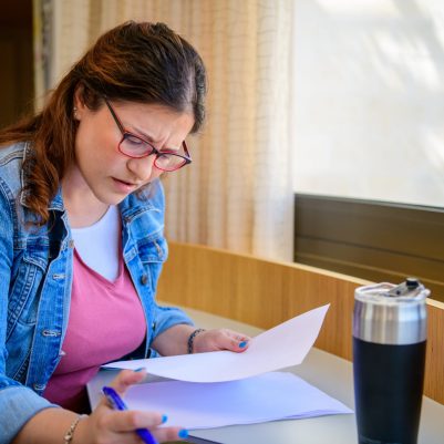 Woman working looking at papers 3
