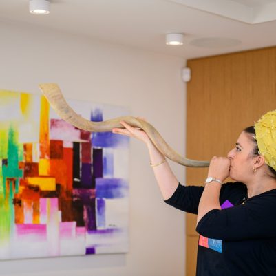 Woman blowing shofar