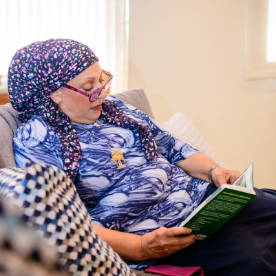 Woman reading on couch 1