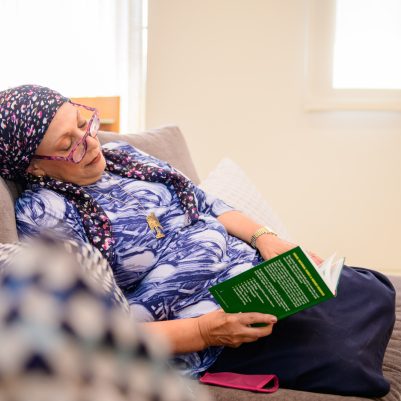 Woman falling asleep reading