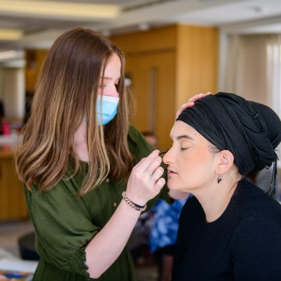Woman getting makeup done 2