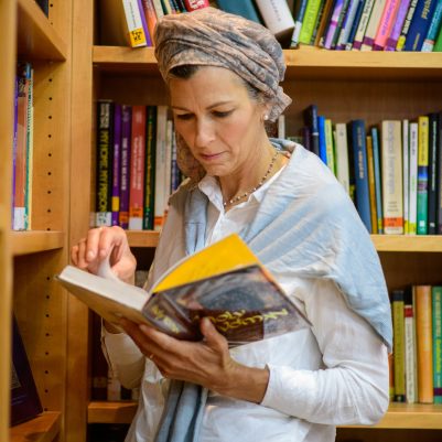 Woman reading in library