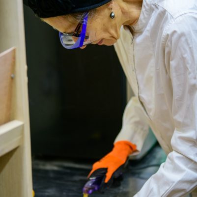 Woman cutting glass with tools 1