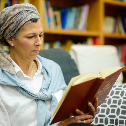 Woman reading in library 1