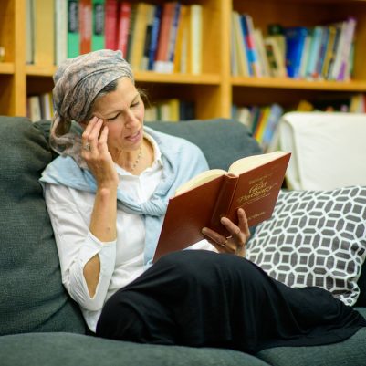 Woman reading in library 4