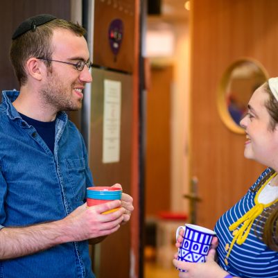 Couple drinking coffee in kitchen 1