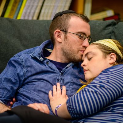 Young couple sitting on couch 1
