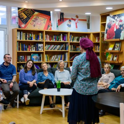 Woman teaching a class in library 1