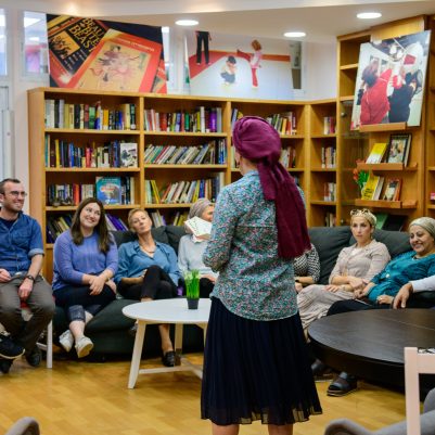 Woman teaching a class in library 2