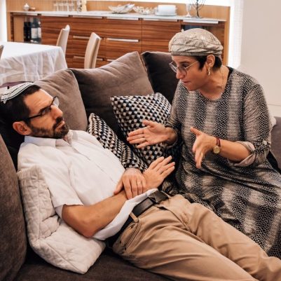 Couple arguing on couch