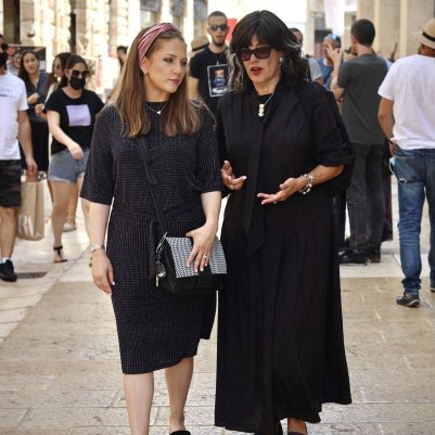 Two women walking in mall 1