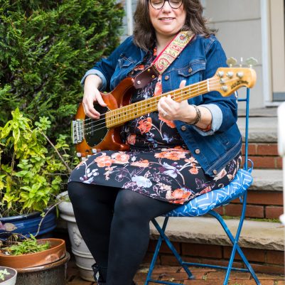 Woman playing guitar outside 2