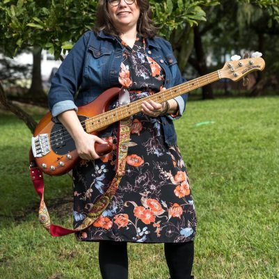 Woman standing with guitar