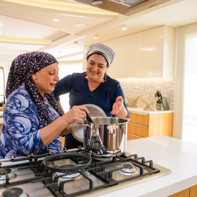 Two women cooking together