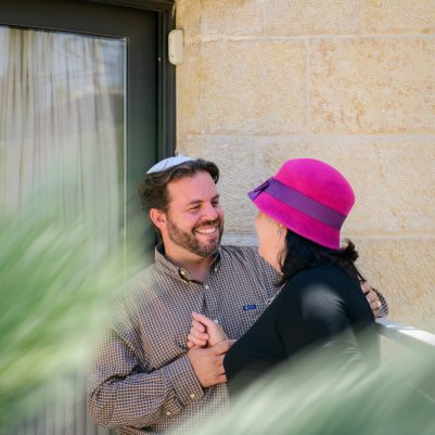 Couple looking at each other outside