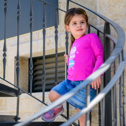 Young girl posing on stairs