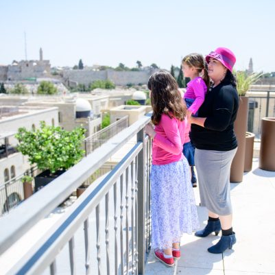 Mother and daughters looking at view of Jerusalem