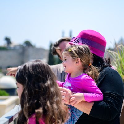 Family outside looking at view