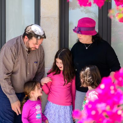 Family posing for picture outside 2