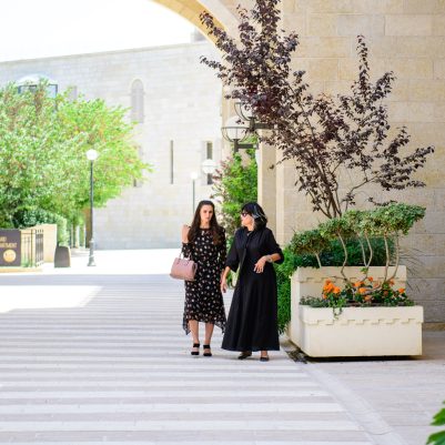 Two women walking outside 2