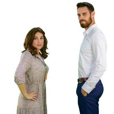 Couple facing each other, looking at the camera