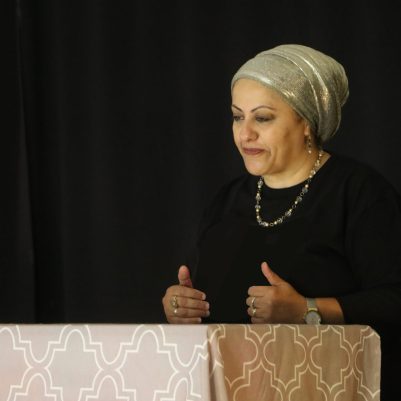 Woman speaking to an audience 2