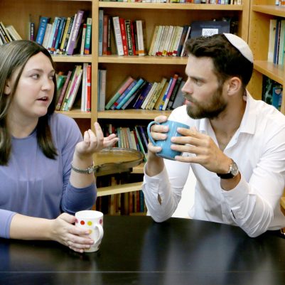 Couple talking and drinking coffee