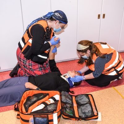Medics treating patient 1