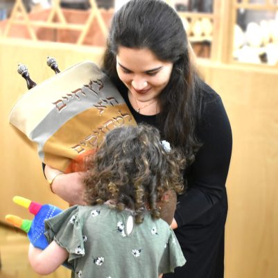 Little girl kissing Torah 1