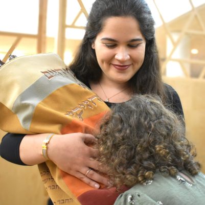 Little girl kissing Torah 2