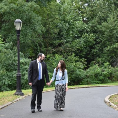 Couple holding hands on a walk 2