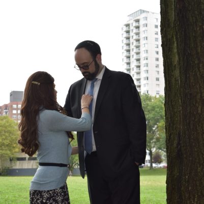 Wife fixing husband's tie