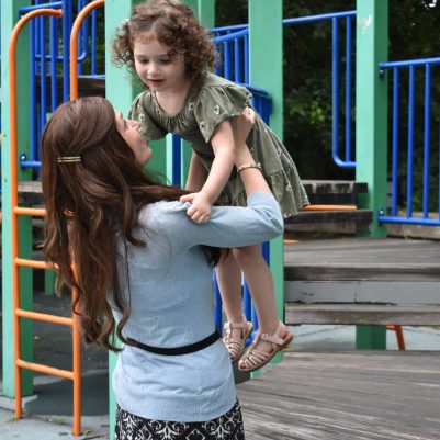 Mother holding daughter