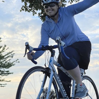 Woman smiling on bicycle 1