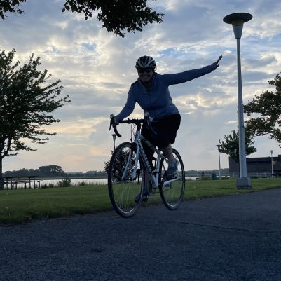 Woman smiling on bicycle 2