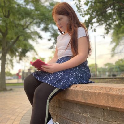 Young girl praying outside 1