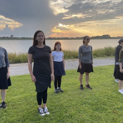 Mothers and daughters exercising in park 1