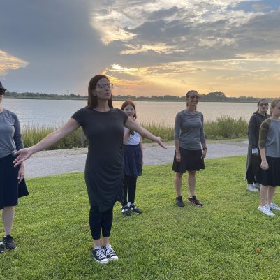 Mothers and daughters exercising in park 2
