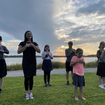 Mothers and daughters exercising in park 4