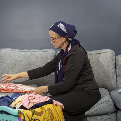 Woman folding laundry 2