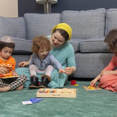 Mother playing with kids in living room 2