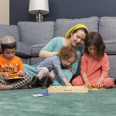 Mother playing with kids in living room 4